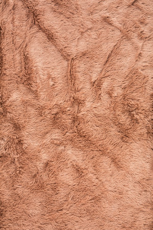 Brown fur background close-up vertical image.