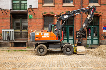 Hamburg, Germany - August 30, 2021 - Atlas 160 W excavator at break time in historical Speicherstadt district in Hanseatic city Hamburg.のeditorial素材