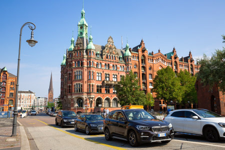 Hamburg, Germany - August 16, 2022 - St. AnnenbrÃ¼cke bridge, red bricks old buildings and cars in famous Speicherstadt warehouse district, a UNESCO World Heritage Site.のeditorial素材