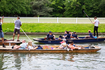 Cambridge, UK - June 2, 2022 - Punting tour along the both sides of river Cam, historic buildings and colleges.のeditorial素材
