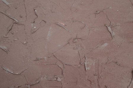 Concrete texture as a background. Brown stucco wall, horizontal picture.