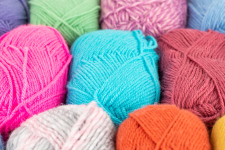 The stack of colorful knitting yarn clews close up picture.の写真素材