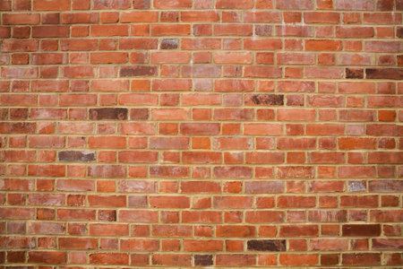 Old red brick wall background, part oh historical building.