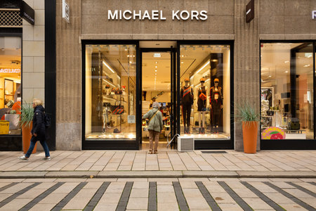 Hamburg, Germany - August 30, 2021 - Michael Kors store entrance in Neuer Wall shopping street, famous American brand of luxury handbags, accessories, perfume, women sportswear.のeditorial素材