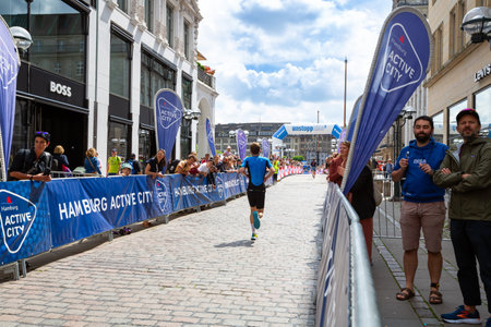 Hamburg, Germany - July 14, 2024 - The athlete running at  the Open Races of the World Triathlon Hamburg, The World's Biggest Triathlon. Triathlete man running.のeditorial素材