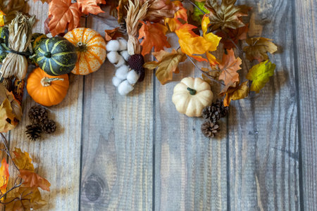 Autum Background with leaves, pumpkins, and grourds.