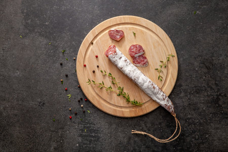 sausage fuet smoked dried dried salami meat on the table breakfast breakfast outdoor top view food...