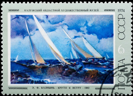 Postal stamp. Beautiful white yachts by the blue sea.の写真素材