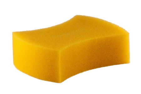 Yellow sponge on a white hum.の写真素材