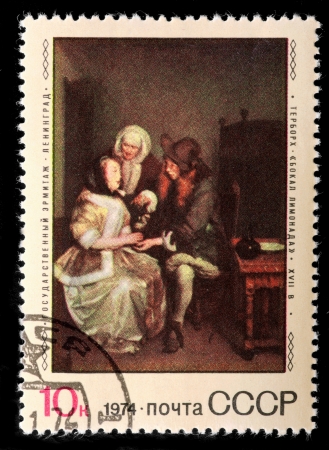 USSR - CIRCA 1974  The postal stamp printed in USSR is shown by the man, CIRCA 1974 のeditorial素材
