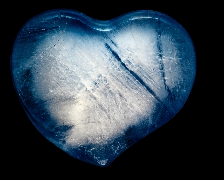 Blue heart of the ice on a black backgroundの写真素材