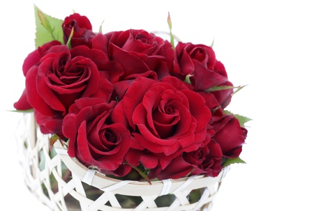 Beautiful roses in basket isolatedの写真素材