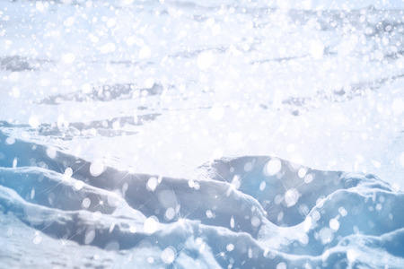 Winter background, snowfall, lights and stars.の写真素材