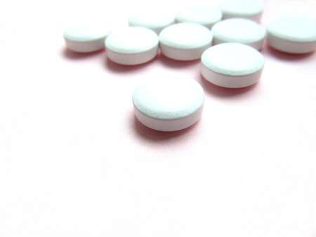 Pill in front of many pills