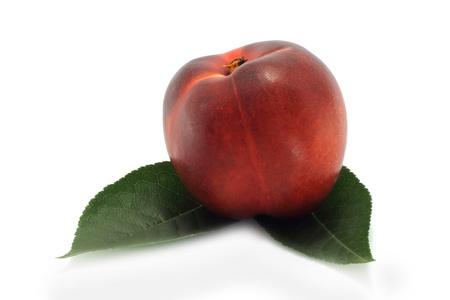 Nectarine and green leavesの写真素材