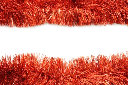 Red tinsel frame close-up on white backgroundの写真素材