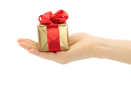 Hand holds present box on a white backgroundの写真素材