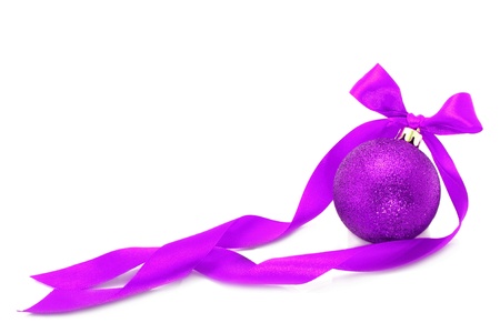 Purple Christmas ball with ribbon on white background の写真素材