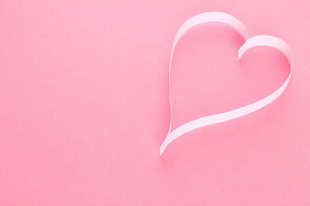 Paper heart on pink background の写真素材