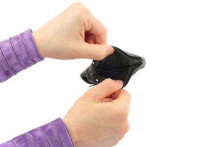 Hands holding empty purse on white background