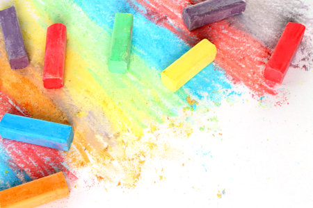 Color pieces of chalk on white 
