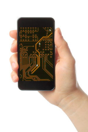 Hand holds smart phone with circuit board on white background の写真素材