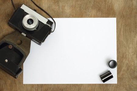 Old camera on wooden background