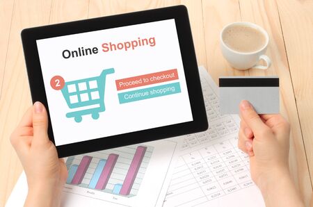 Businesswoman works at her workplace with Tablet PC and credit cardの写真素材