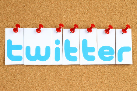 Kiev, Ukraine - September 30, 2015:Twitter logotype printed on paper, cut and pinned on cork bulletin board.Twitter is an online social networking service.のeditorial素材