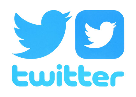 Kiev, Ukraine - May 30, 2016: Collection of Twitter logos printed on paper. Twitter is an online social networking service that enables users to send and read short messages.のeditorial素材