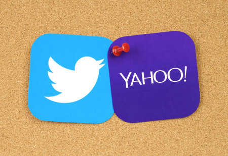 Kiev, Ukraine - September 12, 2016: Twitter and Yahoo icons printed on paper and pinned on cork...