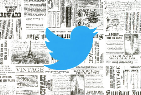 Kiev, Ukraine - January 15, 2018: Twitter logo printed on paper and placed on retro newspaper backgroundのeditorial素材