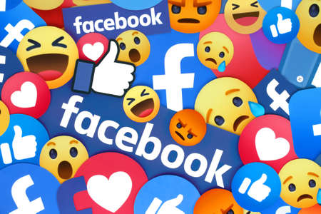 Kiev, Ukraine - February 19, 2021: Background of different Facebook apps icons and emoticonsのeditorial素材