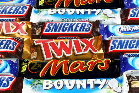 Kiev, Ukraine - December 13, 2021: Background of Mars, Bounty, Twix, Snickers and Milky Way chocolate bars. Mars is a company known for the confectionery items that it createsのeditorial素材