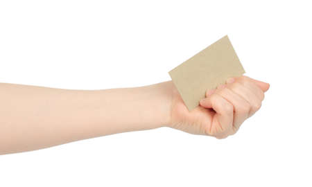 Hand holds blank business card on white background close-upの写真素材