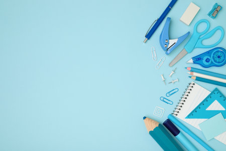 School and office supplies on blue background, template concept, top view close-upの写真素材