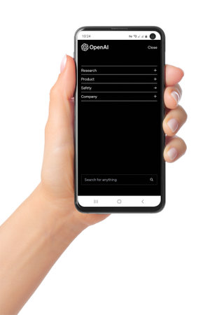 Kiev, Ukraine - March 07, 2023: OpenAI Menu page on phone screen in hand. OpenAI is a non-profit artificial intelligence research organization that aims to promote and develop friendly AIのeditorial素材