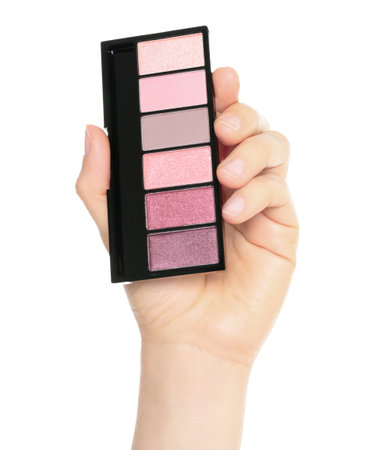 Woman hand holds cosmetic palette, isolated on a transparent background, cosmetics and visage conceptの写真素材