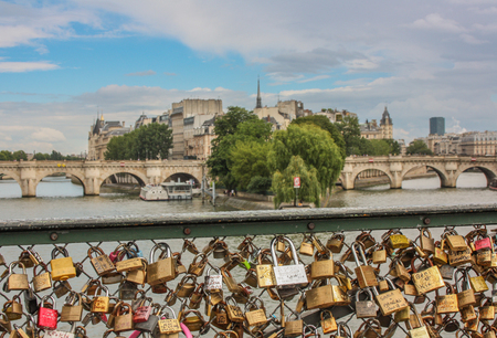 Padlocks on the Arts Bridge over the Seine River in Parisのeditorial素材