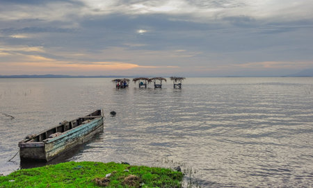 Sunset with a small boat on the shore of Lake Cocibolca