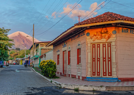 Sunset in the streets of Ometepe Island with the Concepcion volcano covered with clouds in the backgroundのeditorial素材