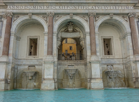 Front view of a fountain in Rome with three arches and water at the bottomのeditorial素材