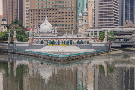 Kuala Lumpur, Malaysia - March 19, 2018: Reflections of the Jamek Mosque on the Klang River that crosses the city of Kuala Lumpurのeditorial素材