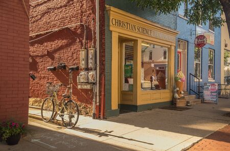 Frederick, Maryland, USA - May 23, 2018: View of a bicycle on a quiet street in the city of Frederick on a summer afternoonのeditorial素材