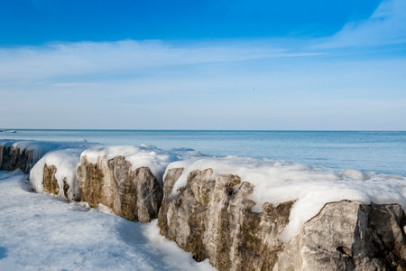 Winter landscape with frozen sea and blue sky. Niagara on the Lake shore.の写真素材