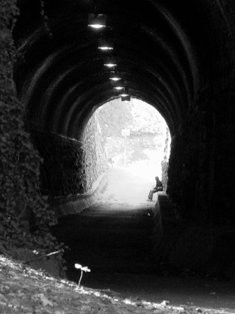 man waiting at the end of the tunnelの写真素材
