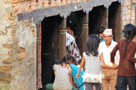 BANDIPUR, NEPAL - OCTOBER 6: Local newar people strolls the main street while playing-shopping-walking on October 6, 2012 in Bandipur-Tanahu District-Gandaki Zone-Nepal.のeditorial素材