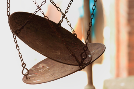 Iron plates of a traditional balance-scales hanging from chains iron-street in the old city area. Dhulikhel-Kavrepalanchok distr.-Bagmati zone-Nepal.の写真素材