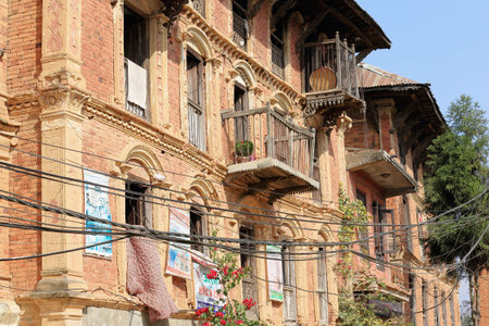 DHULIHEL, NEPAL - OCTOBER 16: Traditional Newar style houses show some ads on Their red brick facades facing the old city area on October 16, 2012 in Dhulikhel-Kavrepalanchok distr.-Bagmati zone-Nepal.のeditorial素材