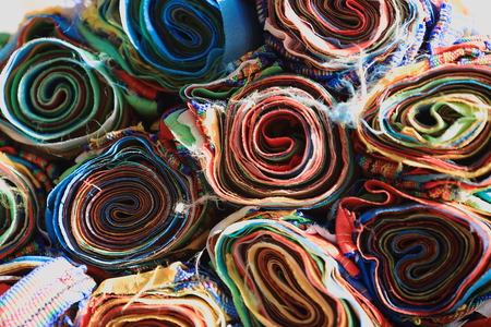 Piled reels of manycolored buddhist prayer flags-shop in a street in the Barkhor area. Lhasa city and prefecture-Tibet A.R.-China.の写真素材